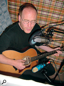 The deep nulls of figure-of-eight mics can help you achieve separation when recording singing guitarists.