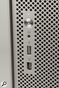 Despite the clean design, the front panel nonetheless manages to conceal the optical drive as well as USB, Firewire and headphone connectors.