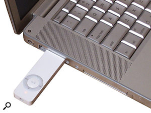 The iPod Shuffle, seen here plugged into a 15-inch Aluminium Powerbook.