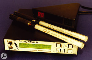 The Lightning II motion-to-MIDI converter, with two of its wand controllers.