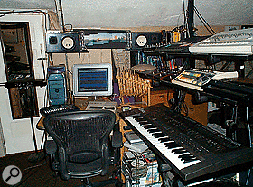 Chris Ewen's sequencing is done not using the Mac but the Roland MC500 MkII next to it. The bamboo object to the right of the Mac is the smaller of his two anklungs.