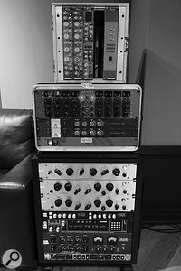 The upper rack in this photo contains the two Focusrite ISA 110 equalisers used on the bass, and an ISA 130 channel strip. The centre rack is home to Seara’s Manley Massive Passive equaliser and Chandler LTD2 compressors, while the lower rack houses (from top) Pultec MEQ5 and EQP1A (x2) equalisers, SSL FXG384 bus compressor, AMS RMX16 reverb, Airfield Liminator compressor and Drawmer MX50 de-esser. 