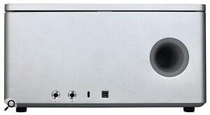 The main left‑right speakers sit behind the front‑panel grille, but on the back, with the line outputs, power inlet and USB‑C socket, is the port of a built‑in subwoofer.