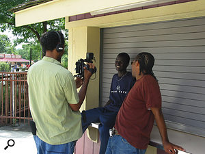 Filmon Mebrahtu (with camera) working on an interview for Dinka Diaries.