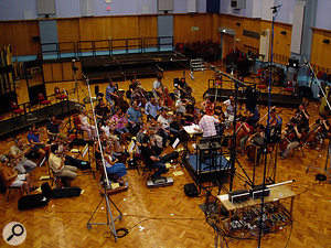 Cut scenes in the game featured specially written music which was tracked in Abbey Road Studio 1, for a more expansive feel. Visible above the conductor is the Decca Tree array of three microphones, with the very high stands containing ambience mics which were eventually used to feed reverb units.