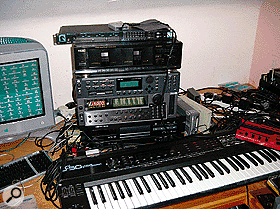 The neatest part of Mike Paradinas' studio is the main working area. Here his G3 Mac shares space with Roland D50 and Clavia Nord Micromodular synths, and (from top) MOTU 2408 audio interface, TEAC W415 dual cassette deck, Emu ESI32 and E5000 samplers, and Tascam DA20 DAT recorder.