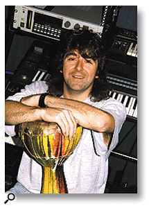 Paul Ward with African talking drum in his studio.