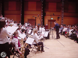Recordings of classical music typically have an incredibly wide dynamic range. In this example waveform (above), for instance, the audio level is generally very low, except for the explosive section about three-quarters of the way through. Sometimes the best way to reduce this dynamic range is to manually ride the fader on mixdown, or draw in volume automation to drop the level of the loudest parts by a few decibels. Once you've done this, you can make up lost gain by turning the signal up at the output stage.