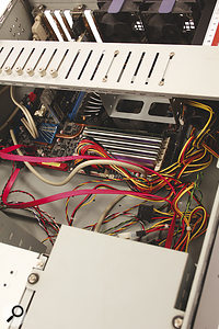 A mess of cables inside your computer case will inhibit airflow — so get the cable clips out and tidy them up!