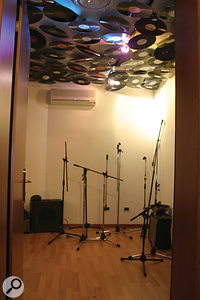 Vinyl records act as reflector/diffusers, hanging from the ceiling.