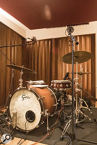 Just as important as how the drums were miked — which was fairly conventional — was how the instrument itself was set up. In this case, toms other than the floor tom were removed, and the kick was tuned down, and its resonant head was damped to help achieve a  dryer, tighter sound.