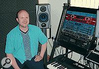 Tim Way in his home studio. The acoustic tiles you can see behind him were left from a previous studio setup, where the sitting position had been facing that wall. However, with the newer equipment configuration these tiles were causing an imbalance in the stereo image.