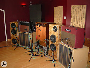 A selection of amps miked up ready for recording, including a Leslie (centre). 