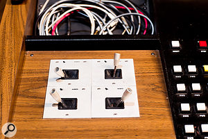 A set of API 480 Quadrasonic Stereo Panners mounted next to the console.