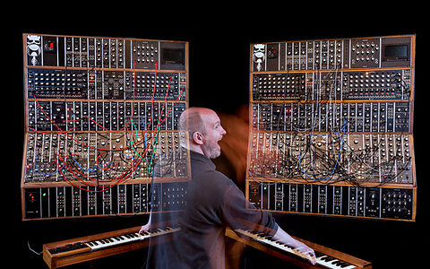 Gordon Reid with Emerson's original Moog Modular on the right, and recreation on the left. Gordon Reid with Emerson's original Moog Modular on the right, and recreation on the left.